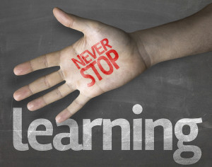 Creative composition with the message "Never Stop Learning"